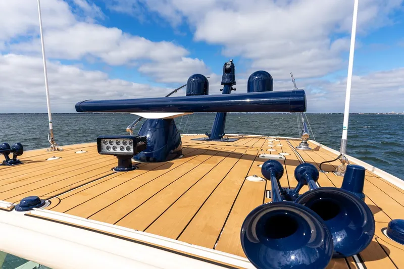 Slide: The Image of 2023 HCB 53 Suenos RXV boat deck with blue accents on open water. - 30
