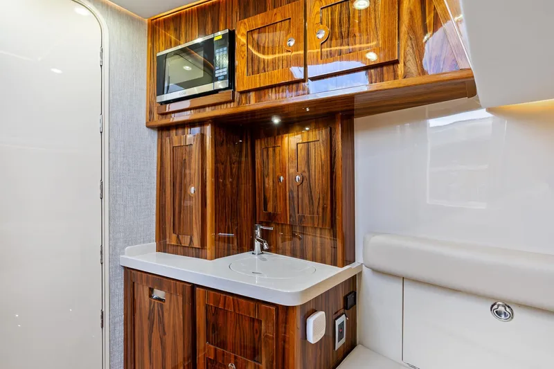 Slide: The Image of Luxurious interior of 2023 HCB 53 Suenos RXV yacht with wood cabinetry and modern amenities. - 35