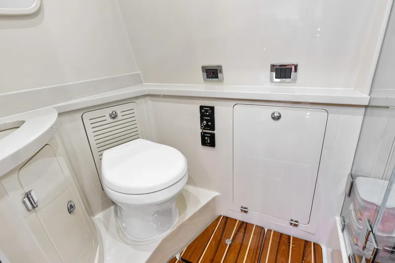 Slide: The Image of 2023 HCB 53 Suenos RXV yacht bathroom with modern fixtures and wooden flooring. - 36