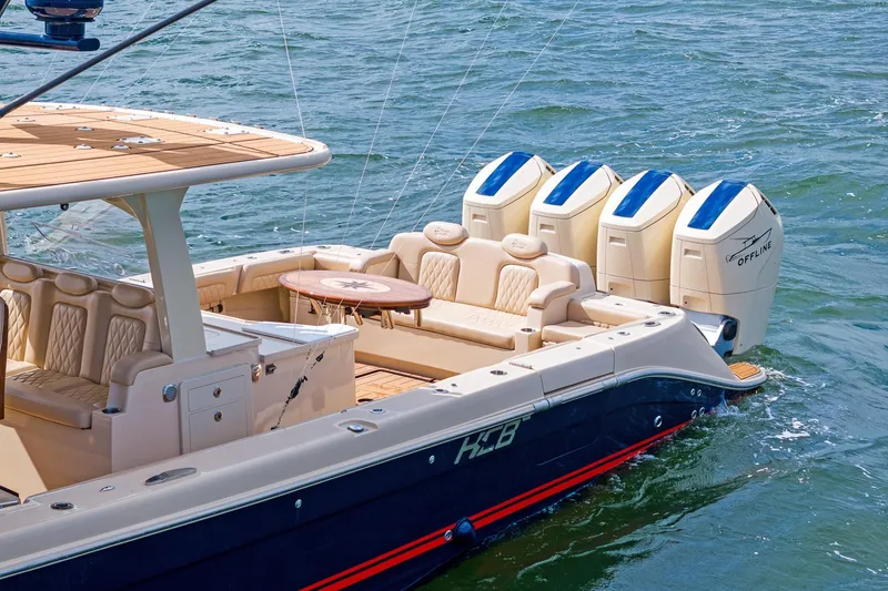 Slide: The Image of 2023 HCB 53 Suenos RXV luxury boat with four powerful engines on the water. - 4