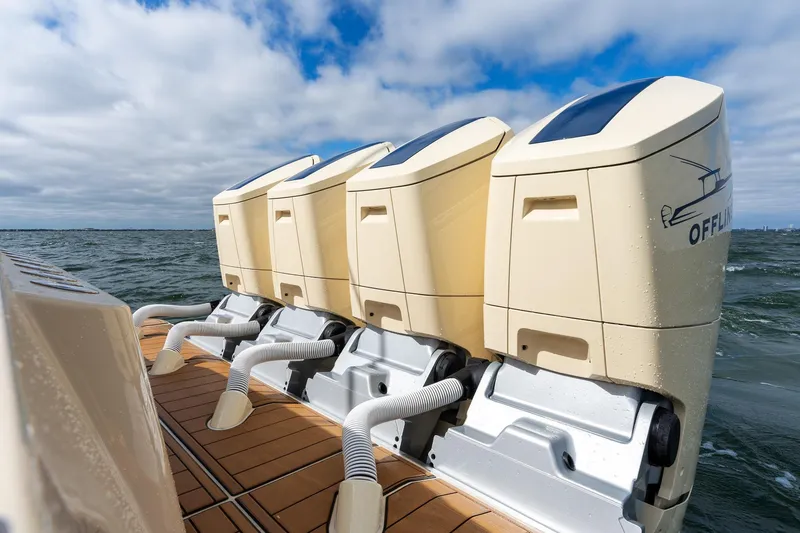 Slide: The Image of 2023 HCB 53 Suenos RXV boat engines on water, showcasing powerful performance. - 13