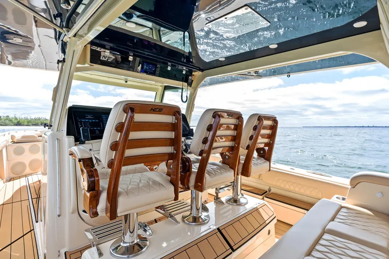 Slide: The Image of Luxurious interior of 2023 HCB 53 Suenos RXV boat with elegant seating and ocean view. - 26