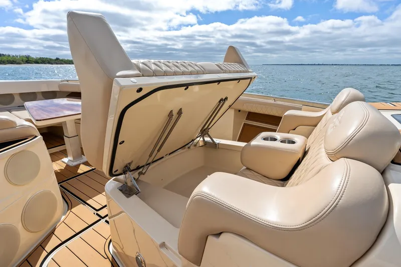 Slide: The Image of 2023 HCB 53 Suenos RXV boat interior with luxurious seating and storage. - 28