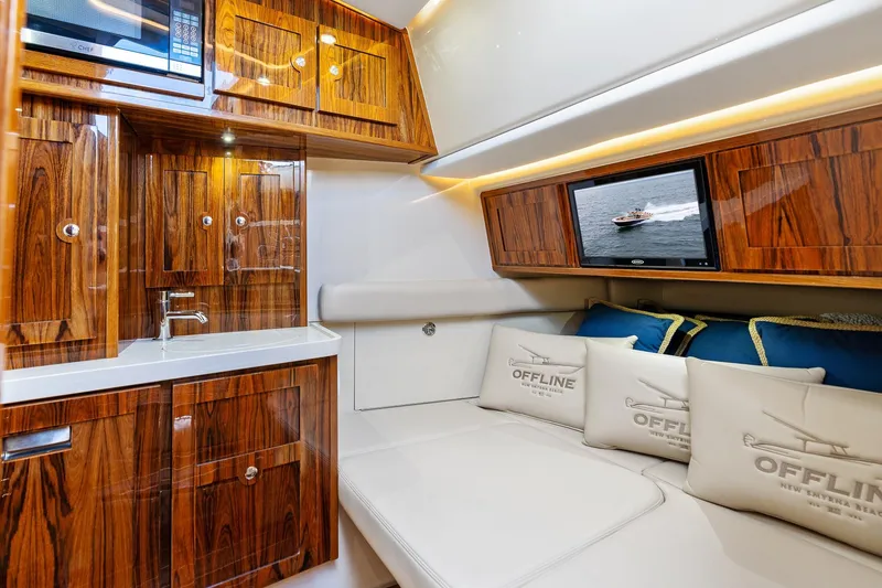 Slide: The Image of Luxurious interior of 2023 HCB 53 Suenos RXV yacht with wood cabinetry and plush seating. - 34