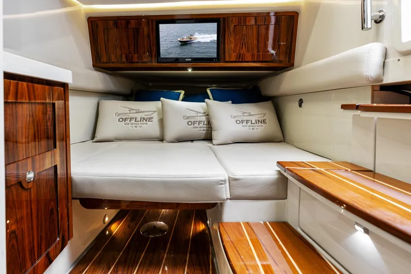 Slide: The Image of Interior of 2023 HCB 53 Suenos RXV yacht with luxurious seating and wood accents. - 37