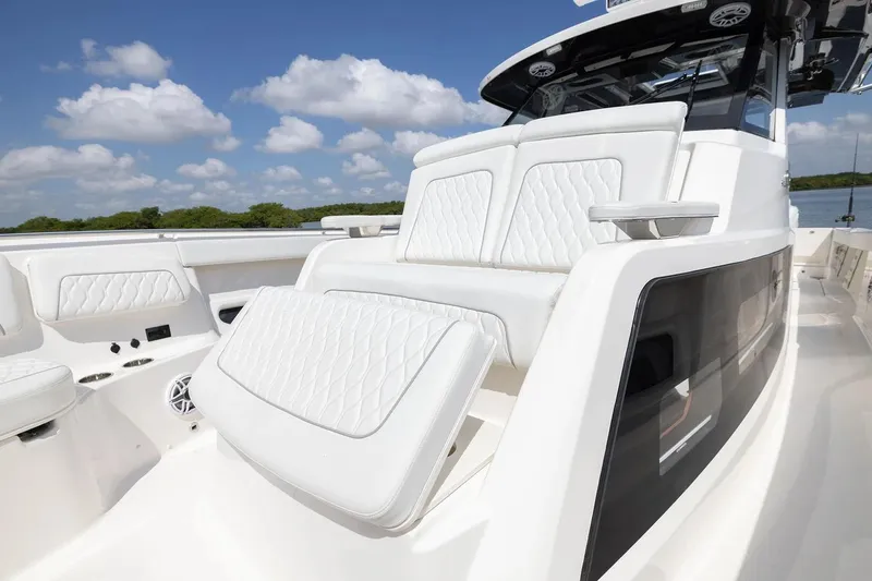 Slide: The Image of Manufacturer Provided Image: 2026 Pursuit S 388 Sport boat with luxurious white seating and sleek design. - 7