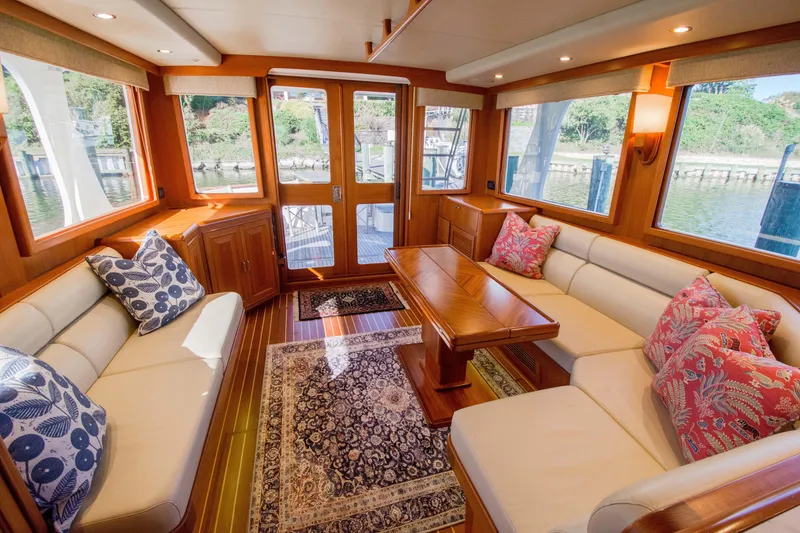 Slide: The Image of Luxurious 2015 Fleming 55 yacht interior with elegant seating and decorative pillows. - 2