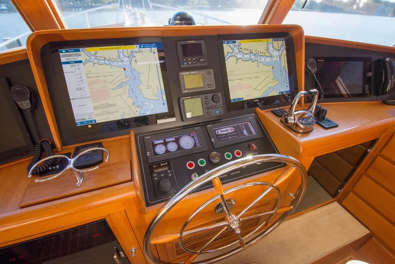 Slide: The Image of Fleming 55 yacht helm with navigation screens and controls, 2015 model. - 23