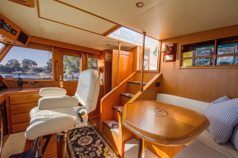 Slide: The Image of Luxurious interior of a 2015 Fleming 55 yacht with elegant seating and wooden finishes. - 25