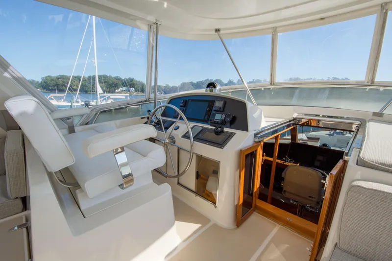 Slide: The Image of Helm of 2015 Fleming 55 yacht with steering wheel and navigation equipment. - 26