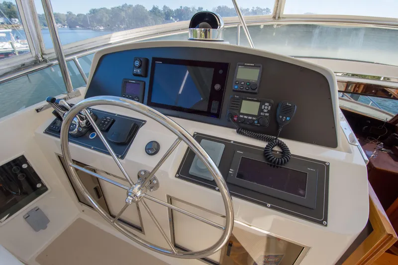 Slide: The Image of Helm of 2015 Fleming 55 yacht with navigation equipment and steering wheel. - 27