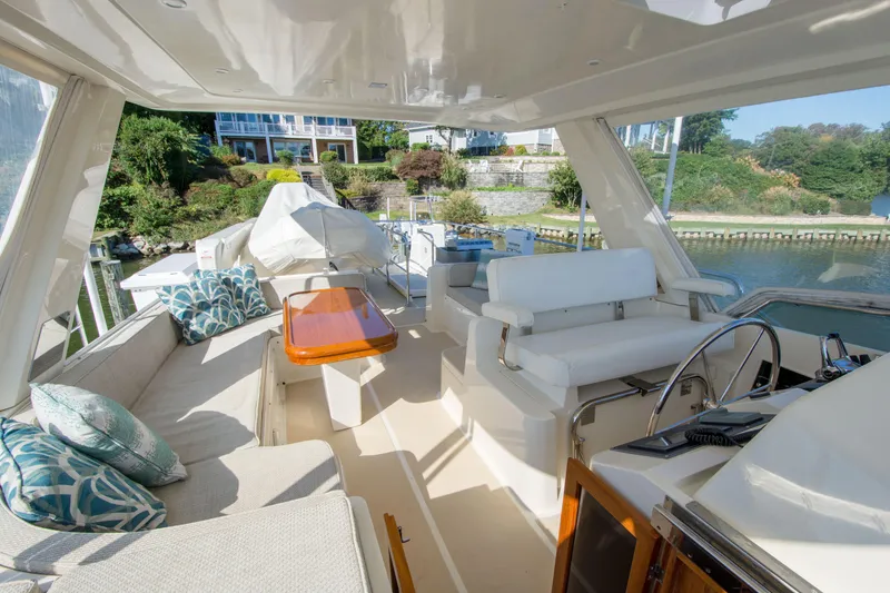 Slide: The Image of Luxurious 2015 Fleming 55 yacht interior with plush seating and elegant design. - 28