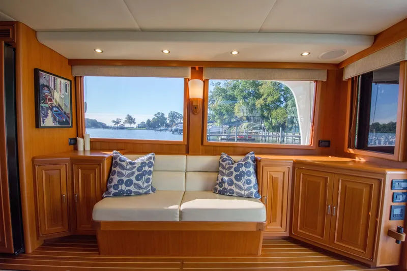 Slide: The Image of Luxurious interior of 2015 Fleming 55 yacht with scenic window view and elegant wood finish. - 3