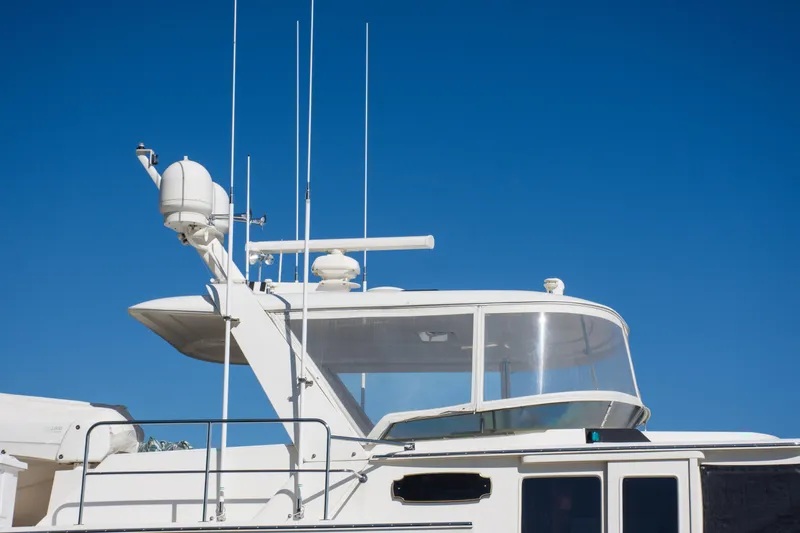 Slide: The Image of Fleming 55 yacht, 2015 model, featuring radar and antennas against a clear blue sky. - 35