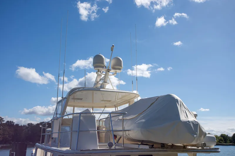 Slide: The Image of 2015 Fleming 55 yacht with radar equipment under a clear blue sky. - 38