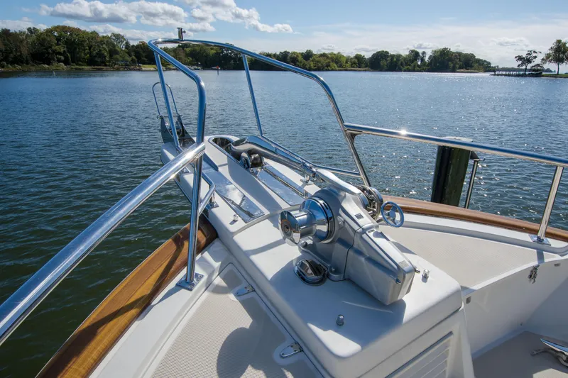 Slide: The Image of Bow of 2015 Fleming 55 yacht with stainless steel railings on a sunny day. - 45