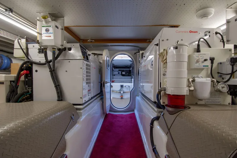 Slide: The Image of Engine room of a 2015 Fleming 55 yacht with Cummins Onan generators. - 49