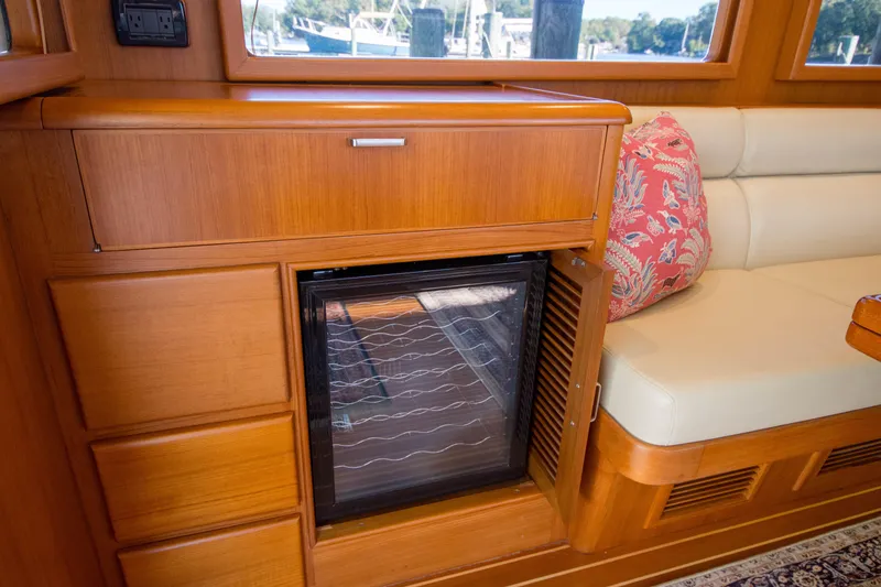 Slide: The Image of Interior of 2015 Fleming 55 yacht with wooden cabinetry and seating area. - 5