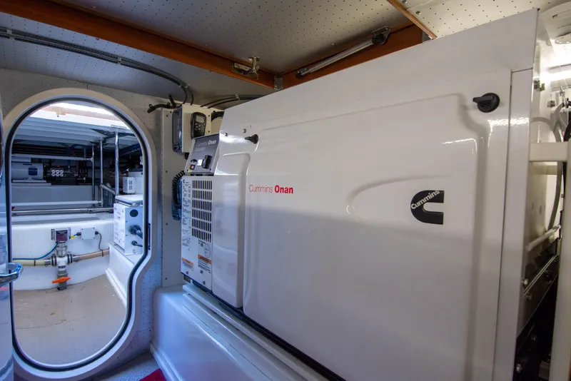 Slide: The Image of Engine room of 2015 Fleming 55 yacht with Cummins Onan generator. - 52