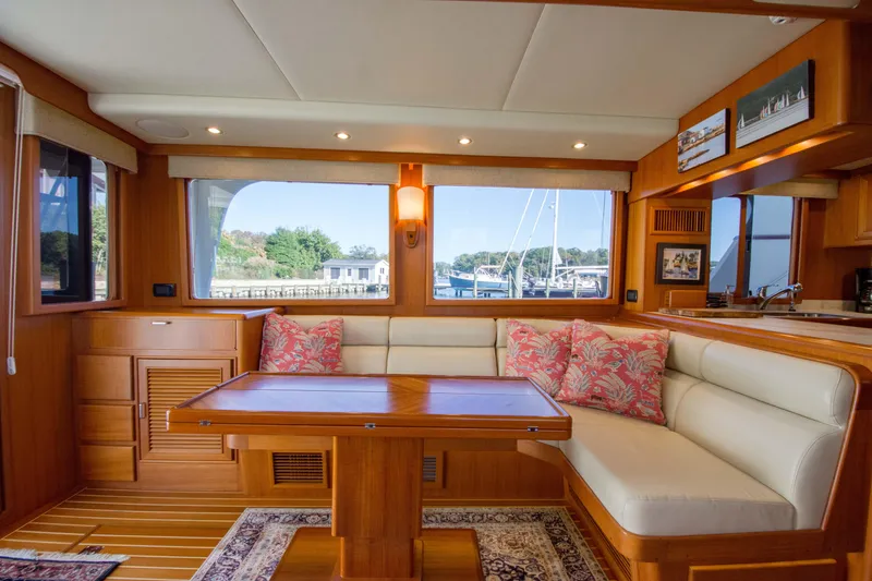 Slide: The Image of Luxurious 2015 Fleming 55 yacht interior with elegant wood finish and comfortable seating. - 6