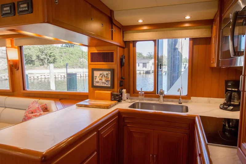 Slide: The Image of Luxurious kitchen interior of 2015 Fleming 55 yacht with waterfront view. - 9