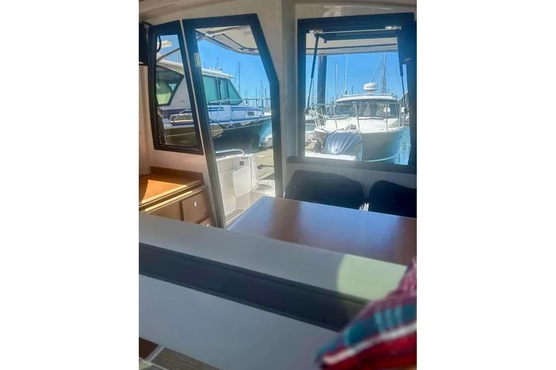 Slide: The Image of Interior of 2025 Cutwater C-248 Coupe boat with modern helm and seating. - 8