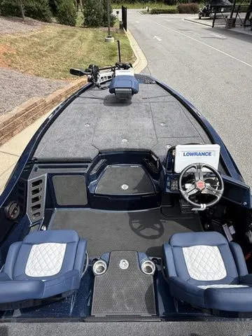 Slide: The Image of 2026 Ikon Boats LXE20 interior with dual seats and Lowrance navigation system. - 4
