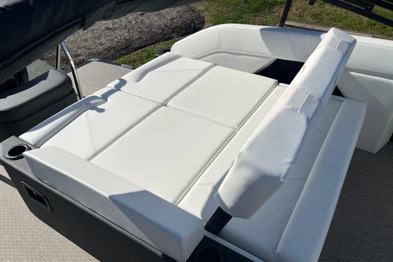 Slide: The Image of Luxurious white seating on 2026 Evotti 523CS boat, featuring adjustable backrests and cup holders. - 12