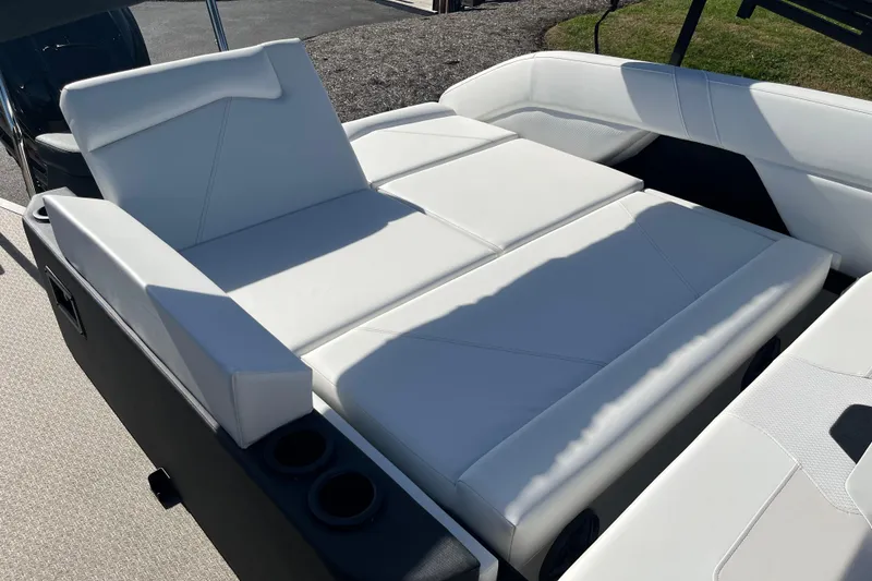 Slide: The Image of Luxurious white seating on 2026 Evotti 523CS boat, featuring cup holders and modern design. - 17