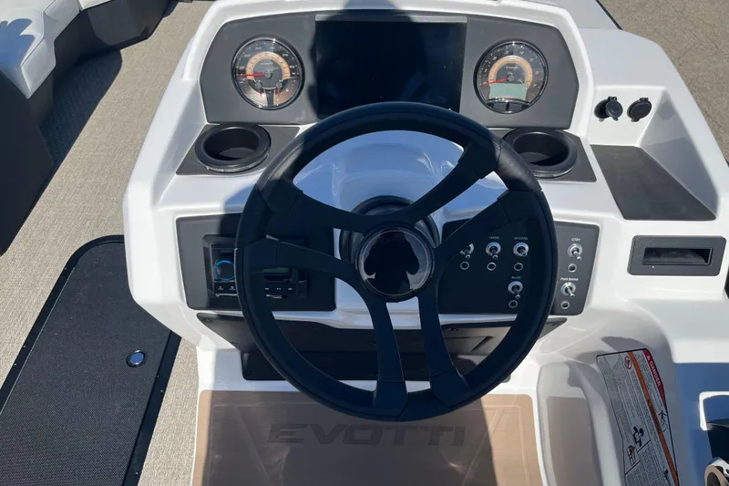Slide: The Image of Steering console of 2026 Evotti 523CS boat with gauges and controls. - 19