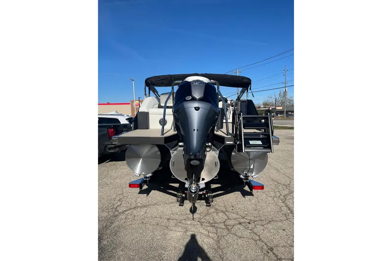 Slide: The Image of Rear view of 2026 Evotti 523CS boat with outboard motor and ladder. - 2