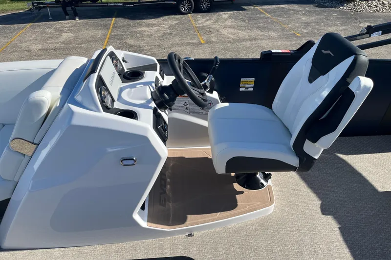 Slide: The Image of Captain's seat and helm of 2026 Evotti 523CS boat, featuring modern controls and navigation. - 26
