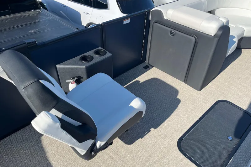 Slide: The Image of 2026 Evotti 523CS boat interior with seating, cup holders, and fire extinguisher. - 9