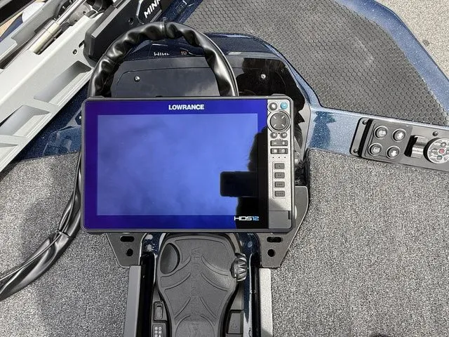 Slide: The Image of 2026 Ikon Boats LXE20 dashboard with Lowrance HDS12 display and controls. - 11
