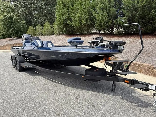 Slide: The Image of 2026 Ikon Boats LXE20 on trailer, sleek design, parked outdoors. - 3