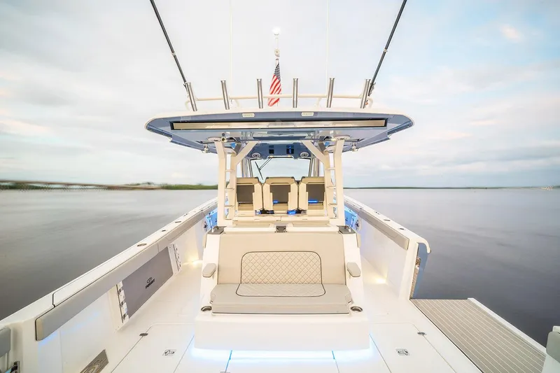 Slide: The Image of Manufacturer Provided Image: 2025 Pursuit S 428 Sport boat interior with seating and open water view. - 10