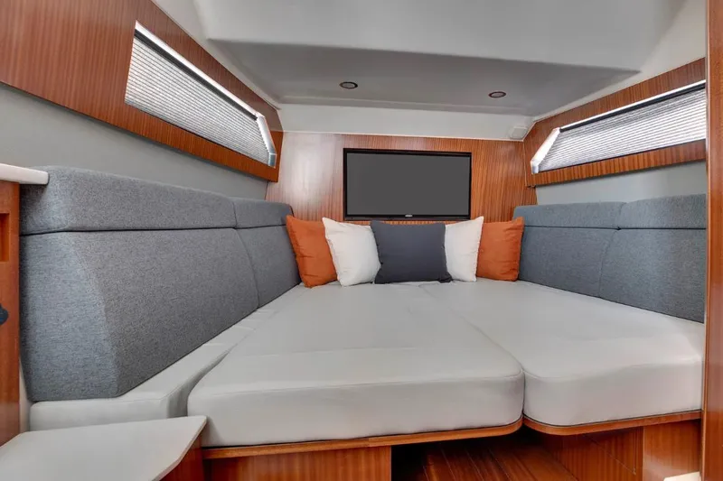 Slide: The Image of Manufacturer Provided Image: Luxurious interior cabin of 2025 Pursuit S 428 Sport boat with modern seating. - 19