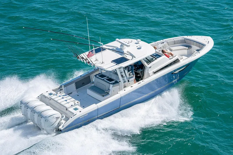 Slide: The Image of Manufacturer Provided Image: 2025 Pursuit S 428 Sport boat cruising on open water. - 3