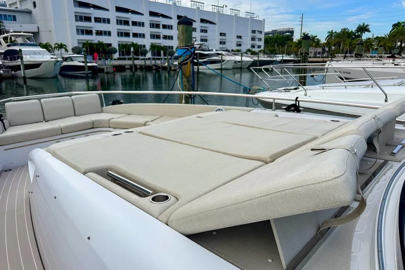 Slide: The Image of 2023 Azimut Verve 47 yacht with spacious sunbathing area and luxurious seating at marina. - 10