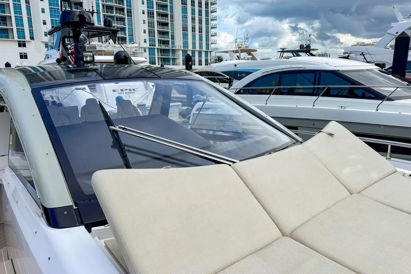 Slide: The Image of 2023 Azimut Verve 47 yacht with luxurious deck, docked at marina. - 17