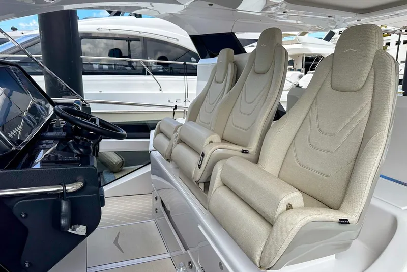 Slide: The Image of 2023 Azimut Verve 47 helm with luxurious seating and modern controls. - 19