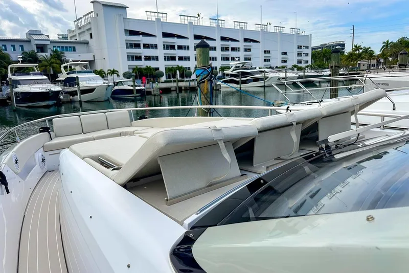 Slide: The Image of 2023 Azimut Verve 47 yacht with luxurious seating at a marina. - 9