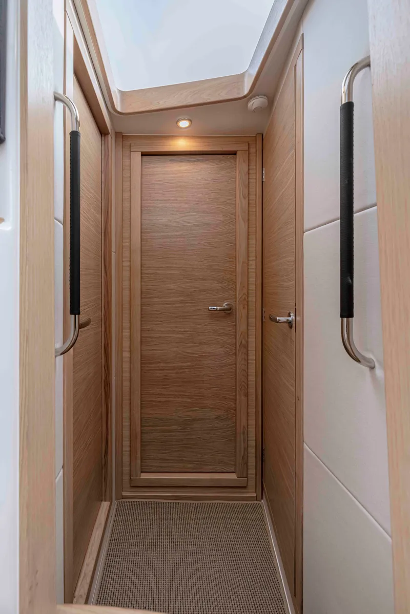 Slide: The Image of Interior hallway of 2025 Nimbus 365 Coupe, featuring wooden door and modern design. - 21