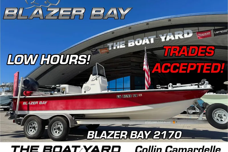The Image of 2014 Blazer Bay 2170 boat at dealership, low hours, trades accepted, displayed outdoors. - 0