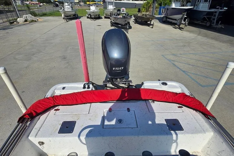 Slide: The Image of 2014 Blazer Bay 2170 boat with Yamaha 150 engine, parked outdoors. - 9