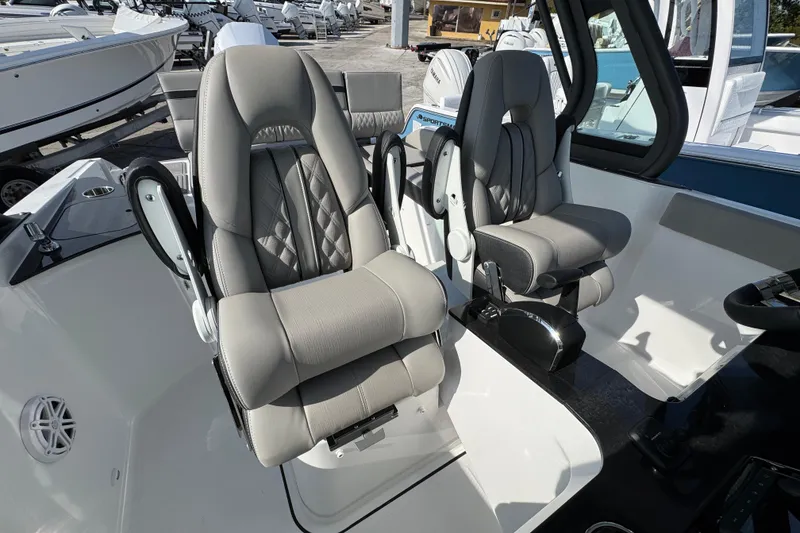 Slide: The Image of Luxury seating on 2026 Monterey Elite 25 OB boat, featuring modern design and comfort. - 7