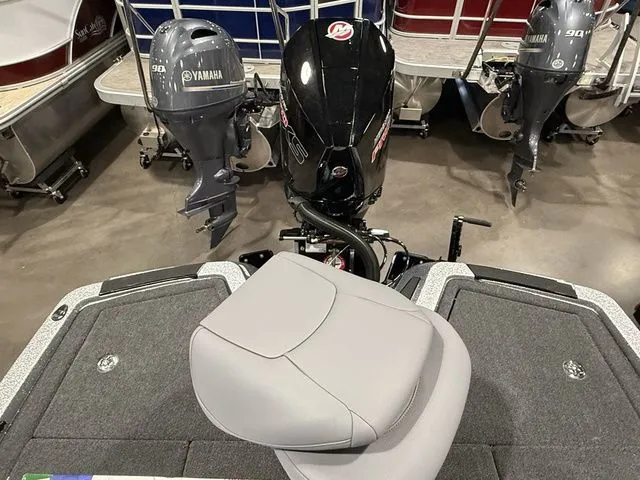 Slide: The Image of 2026 Ikon Boats LXE20 with Yamaha and Mercury outboard motors in showroom. - 18