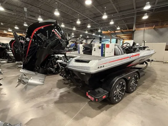 Slide: The Image of 2026 Ikon Boats LXE20 in showroom, featuring sleek design and powerful outboard motor. - 3