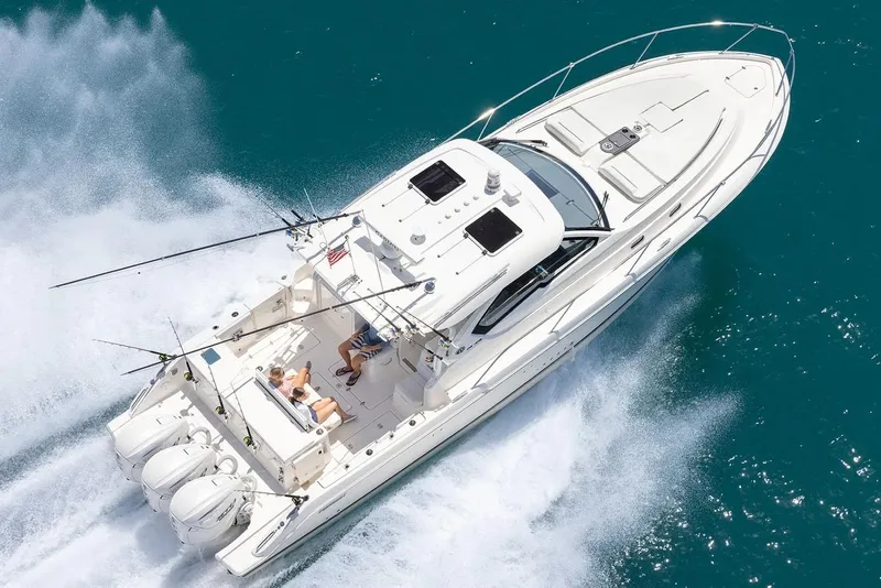 Slide: The Image of Manufacturer Provided Image: 2025 Pursuit OS 405 Offshore boat cruising on clear blue water. - 5