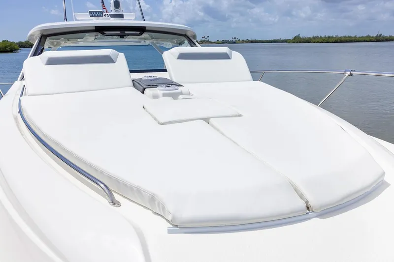 Slide: The Image of Manufacturer Provided Image: 2025 Pursuit OS 405 Offshore yacht with spacious sun deck and luxurious seating. - 8